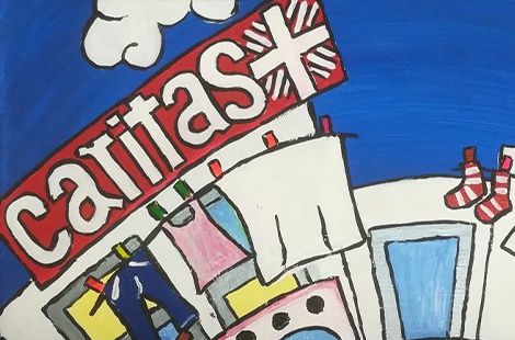 Bild mit Caritas-Flammenkreuz und Schriftzug